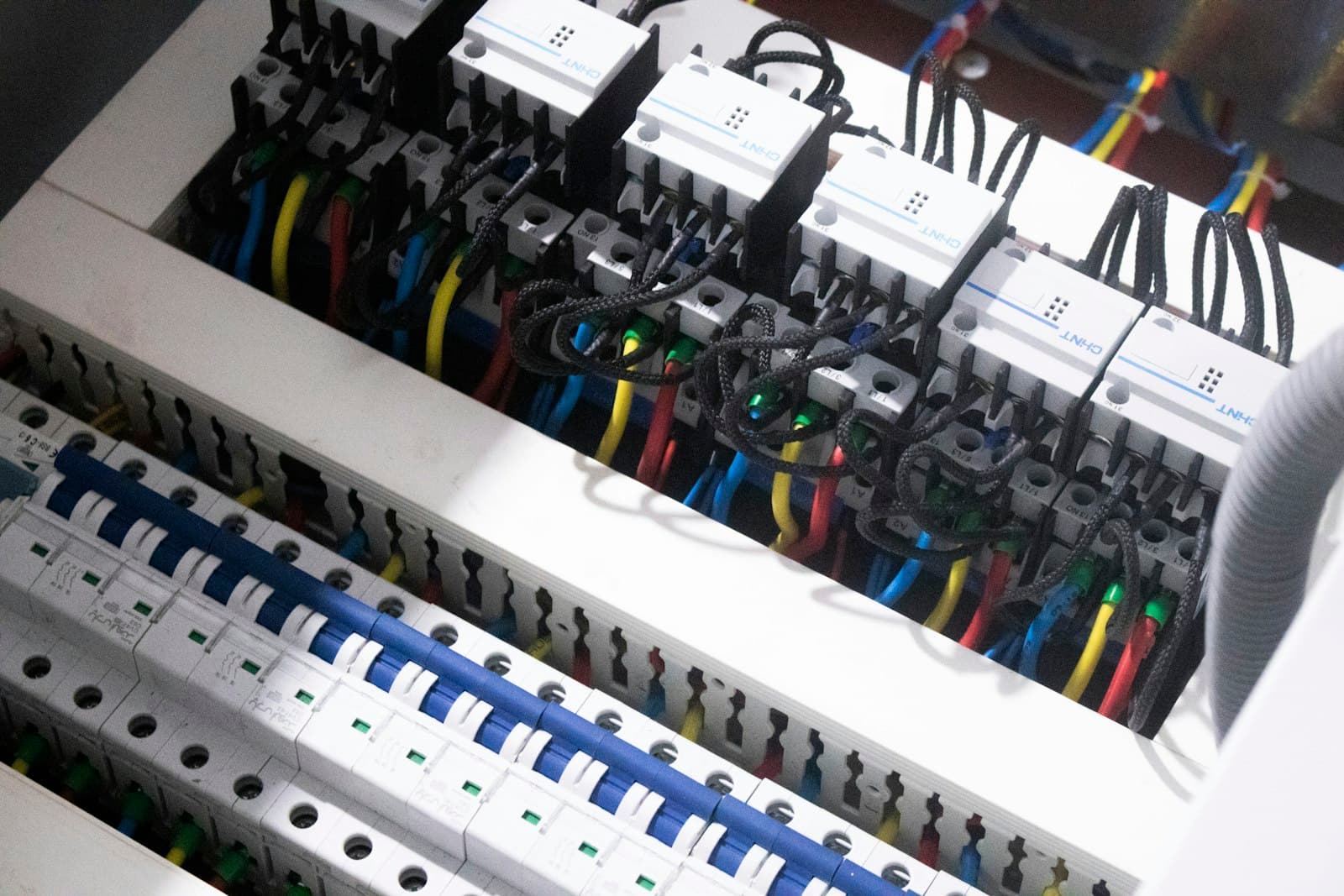 A neatly wired distribution board mid-installation